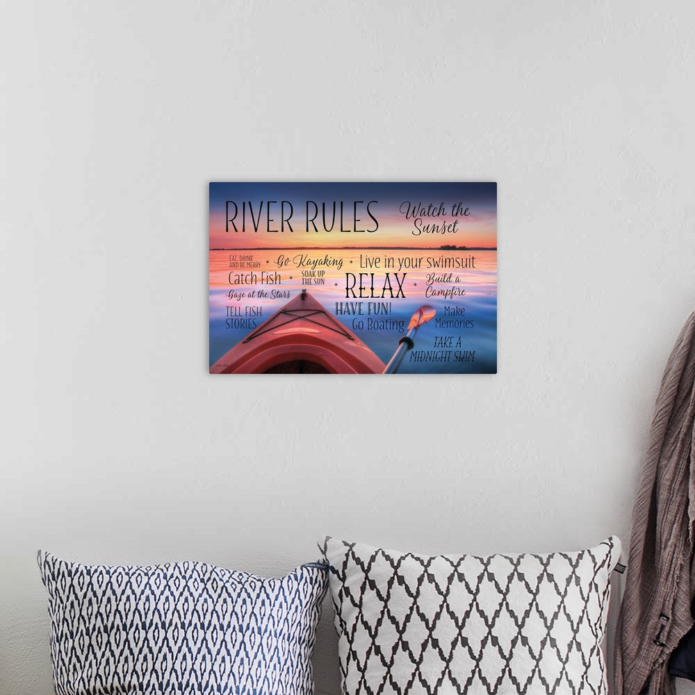 A bohemian room featuring Photo of a kayak on a lake at sunset, with "River Rules" in different fonts and sizes around it.