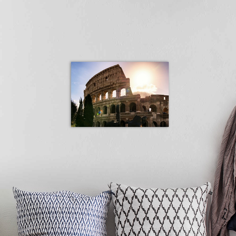 A bohemian room featuring It's a view of the Colosseum at sunset in the centre of the city of Rome, Italy.