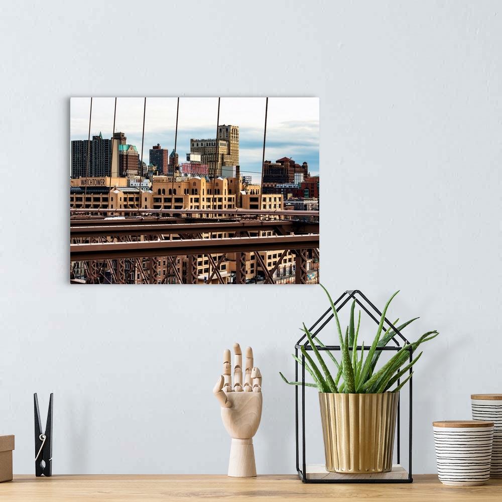 A bohemian room featuring A photograph of the New York city skyline from a bridge.