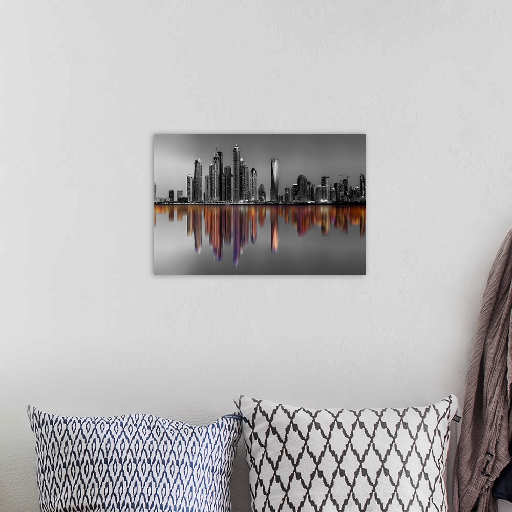 A bohemian room featuring Black and white image of hte Marina Towers in Dubai, with a reflection in color.