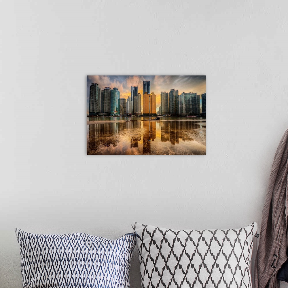 A bohemian room featuring Dramatic photograph of a city skyline with immense skyscraper reflected in a puddle in the foregr...