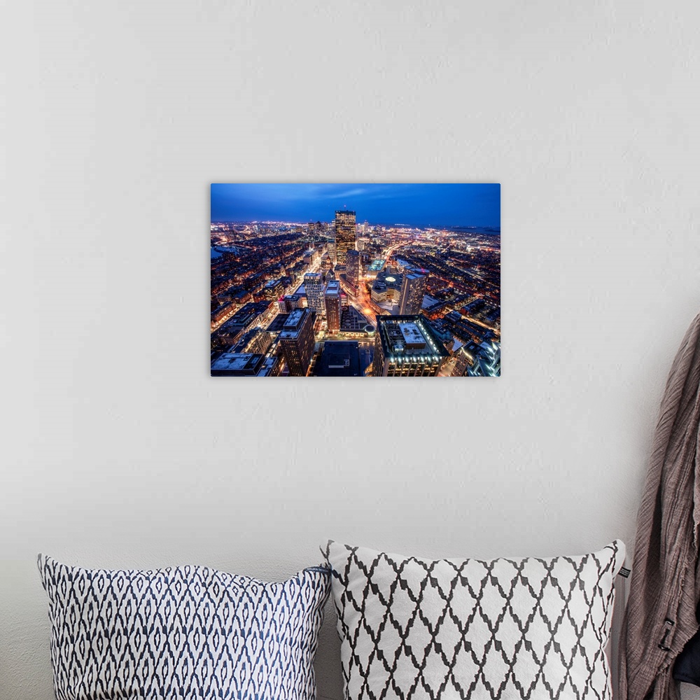 A bohemian room featuring Photo of Boston cityscape at night featuring the John Hancock Tower.
