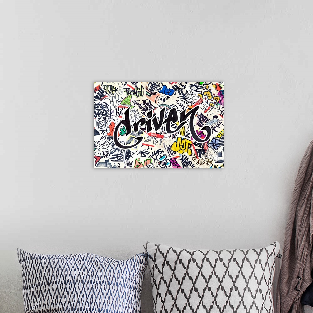 A bohemian room featuring Graffiti-style lettering over a grunge background of pop stickers and symbols.