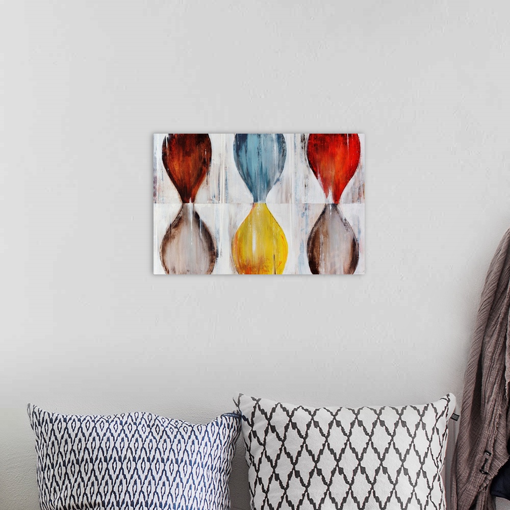 A bohemian room featuring Various hourglass shapes done in contrasting colors on top of a neutral background.