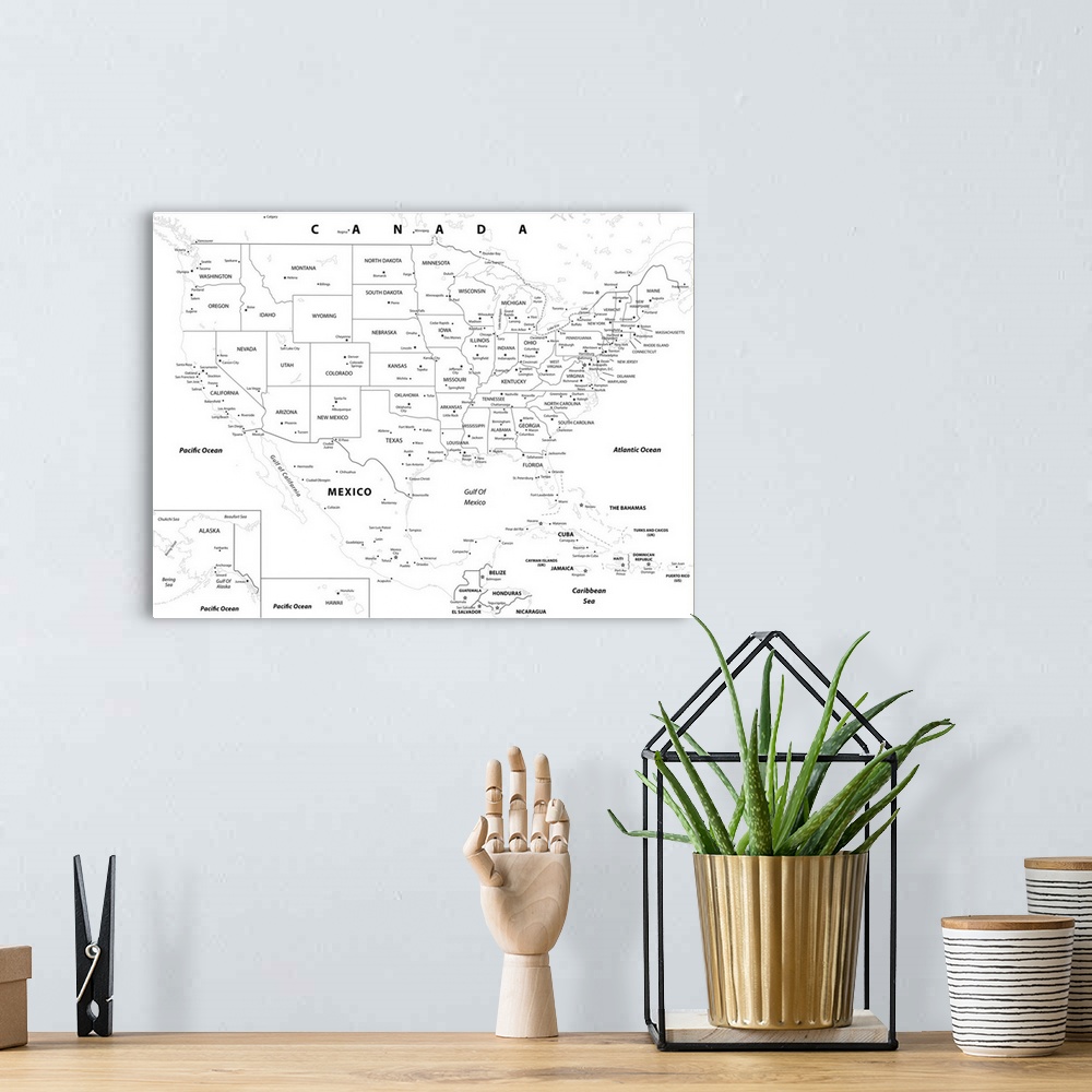 A bohemian room featuring Black and white outlined map of the United States with a modern font.