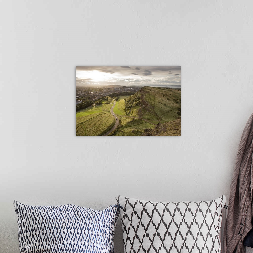 A bohemian room featuring Photograph of Salisbury Crags, Castle Rock, and the city of Edinburgh, Scotland from Holyrood Park.