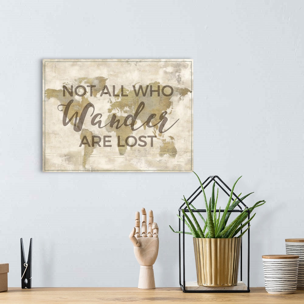 A bohemian room featuring "Not All Who Wander Are Lost" on a world map in gold with a distressed appearance.