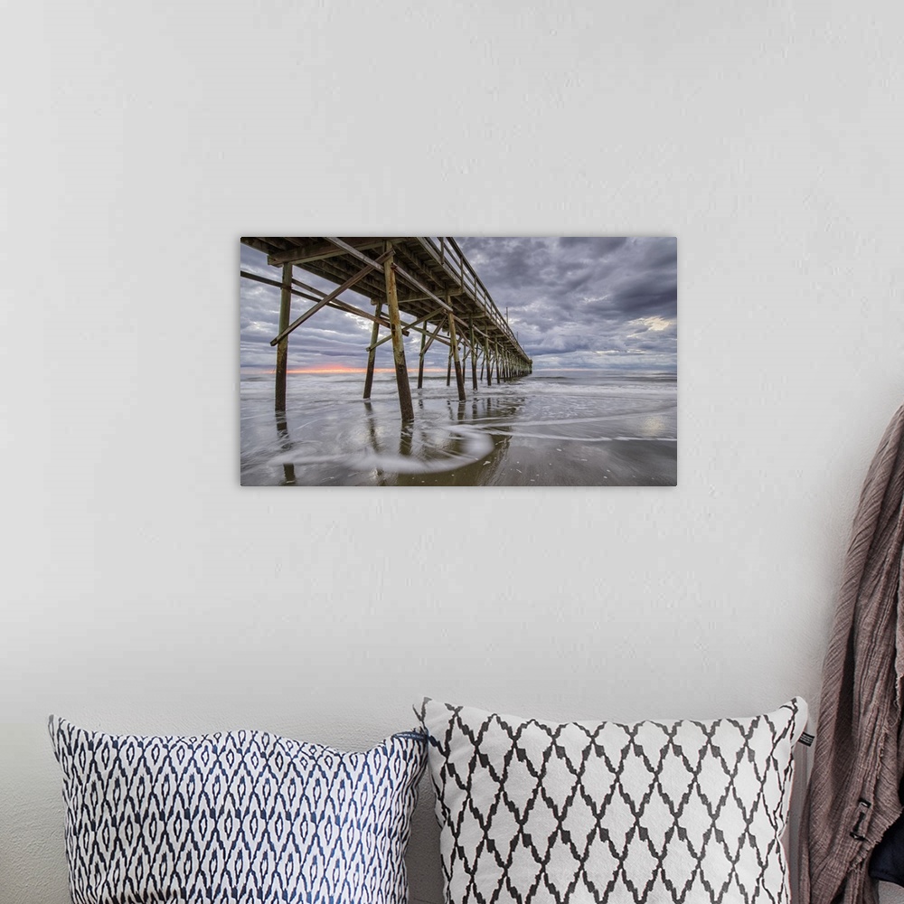 A bohemian room featuring Beach, ocean, waves and pier at sunrise, Sunset Beach, North Carolina, United States of America, ...
