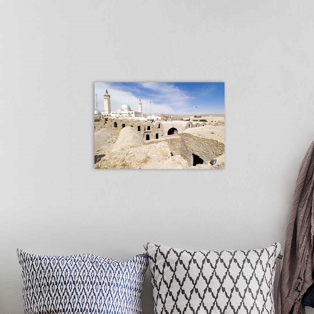 A bohemian room featuring Berber grain storage units, recent site of Star Wars film, Ksar Hedada, Tunisia
