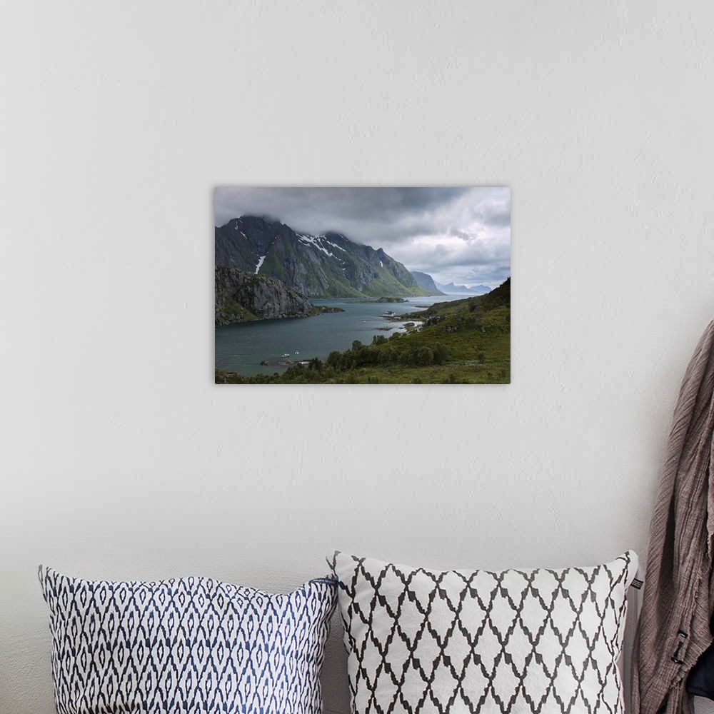 A bohemian room featuring Blue lights and clouds on the calm sea surrounded by rocky peaks at night, Tangstadpollen, Vestva...