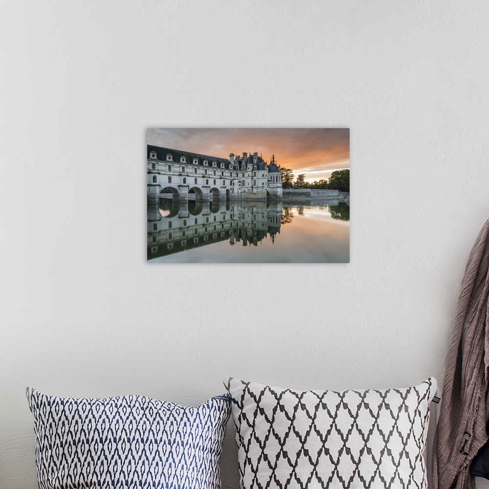 A bohemian room featuring Chenonceau castle reflected on the Loire at sunset, Chenonceaux, Indre-et-Loire, Loire Valley, Ce...
