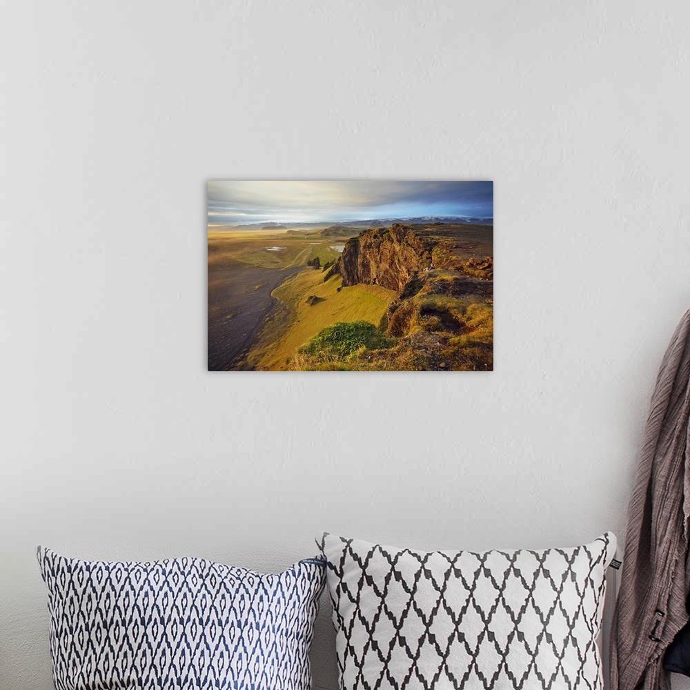 A bohemian room featuring Cliff and mountain view from Dyrholaey Island, just before sunset, near Vik, south coast of Icela...