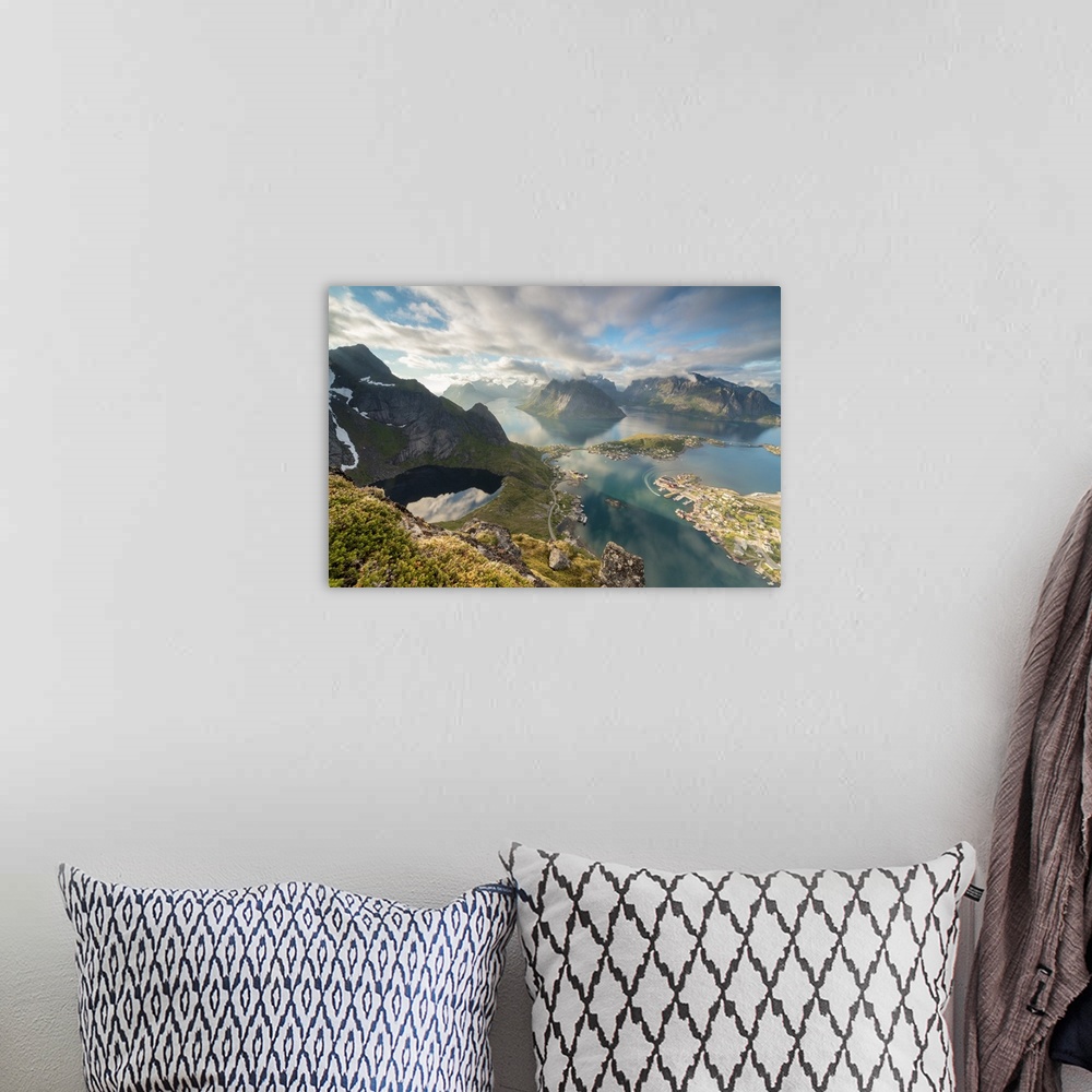 A bohemian room featuring Clouds reflected in blue lake and sea framed by rocky peaks, Reinebringen, Moskenesoya, Lofoten I...