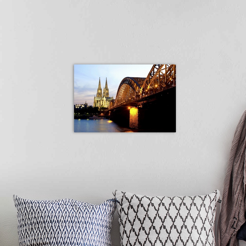 A bohemian room featuring Cologne cathedral and Hohenzollern bridge at night, Cologne, Germany