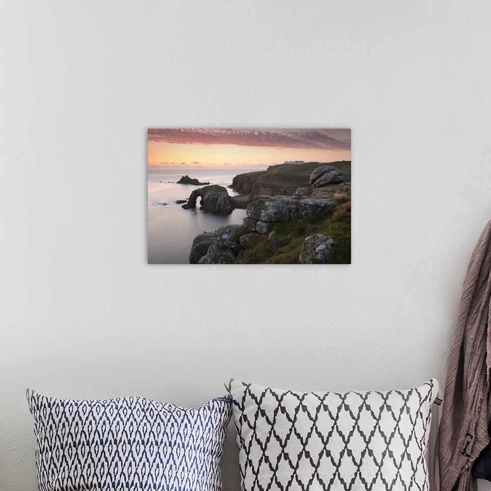 A bohemian room featuring A colourful sunset overlooking the islands of Enys Dodnan and the Armed Knight at Lands End, Corn...