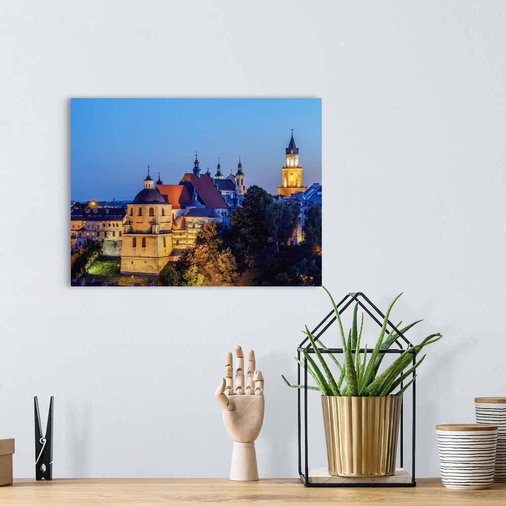 A bohemian room featuring Dominican Priory and Trinitarian Tower at twilight, Old Town, City of Lublin, Lublin Voivodeship,...