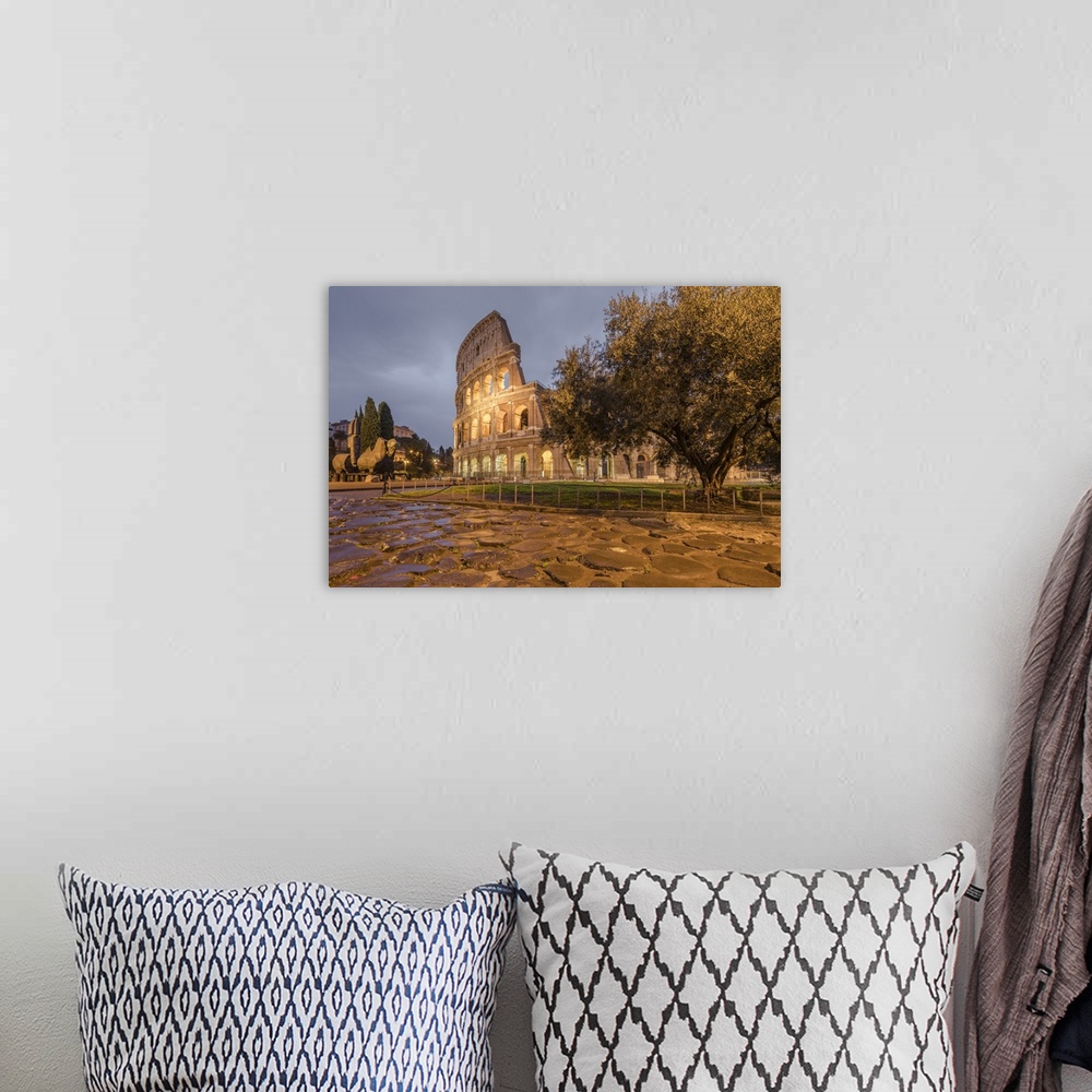 A bohemian room featuring Dusk lights on the Colosseum, the old Flavian Amphitheatre, and symbol of the city, Rome, Lazio, ...