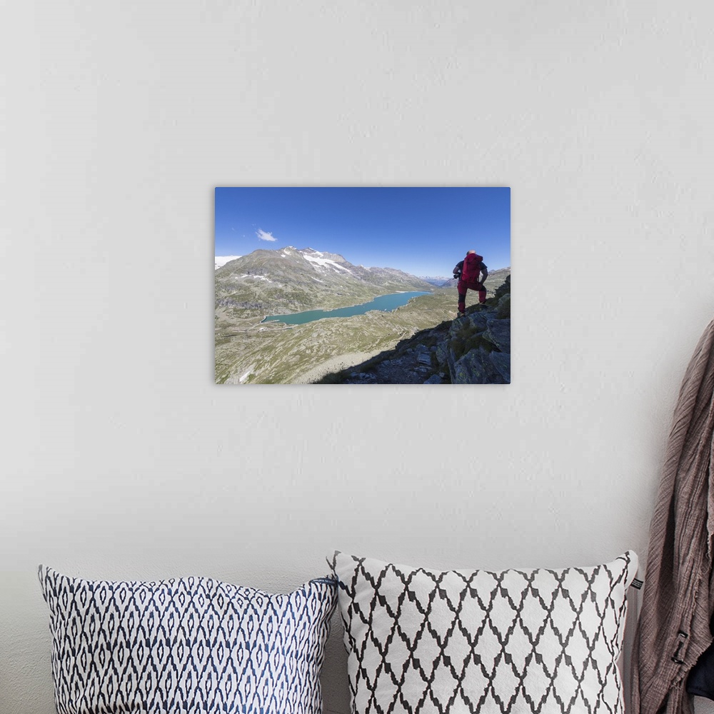 A bohemian room featuring Hiker admires the blue alpine lake from Pizzo Campaccio, Bernina Pass, Canton of Graubunden, Enga...