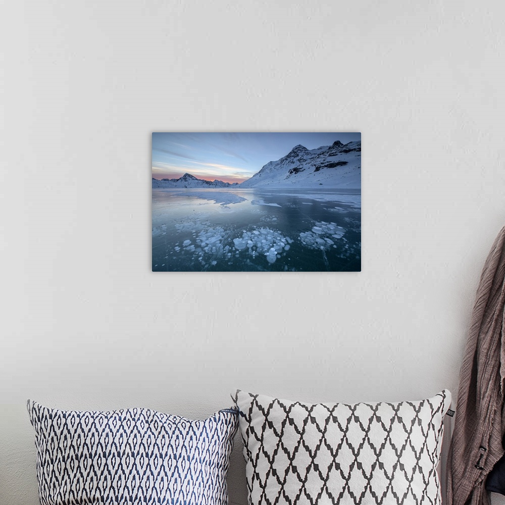 A bohemian room featuring Ice bubbles frame the snowy peaks reflected in Lago Bianco, Bernina Pass, canton of Graubunden, E...
