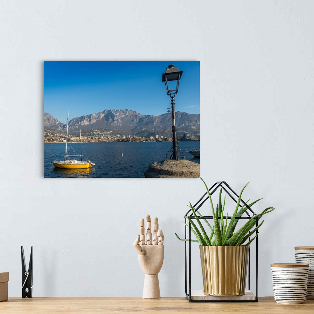 A bohemian room featuring Lake of Lecco, a branch of Lake Como in the southern Alps with the city of Lecco in the backgroun...