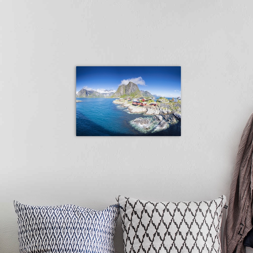 A bohemian room featuring Panorama of the fishing village framed by blue sea and high peaks, Hamnoy, Moskenesoya, Nordland ...
