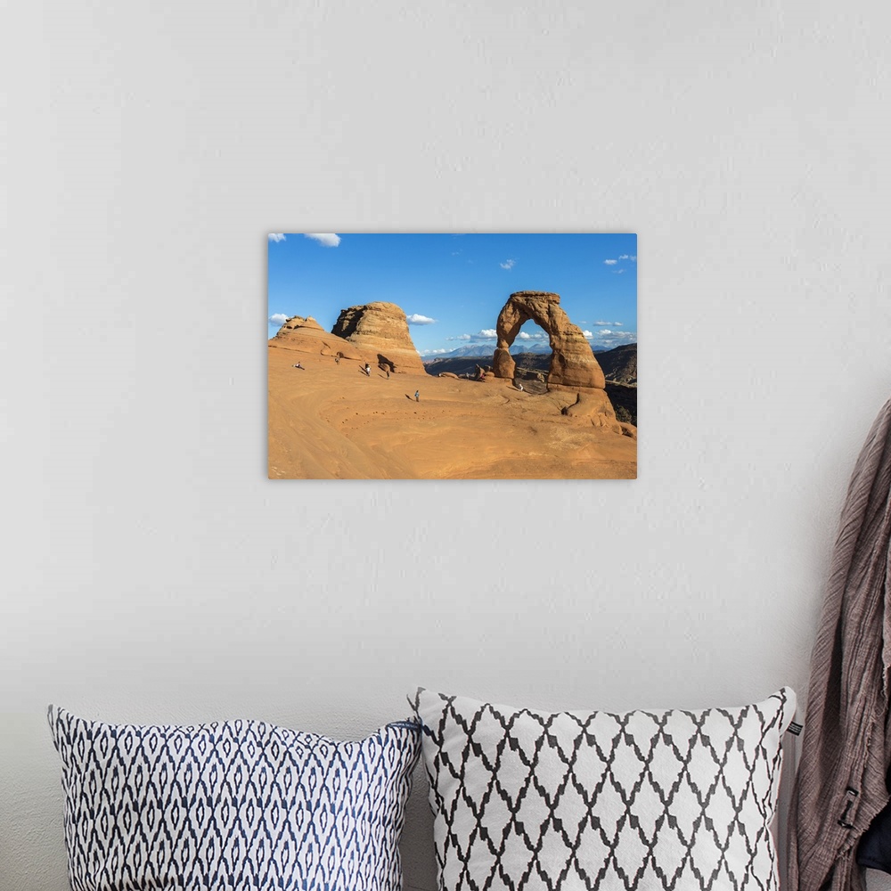 A bohemian room featuring Peoples at Delicate Arch at golden hour, Arches National Park, Moab, Grand County, Utah