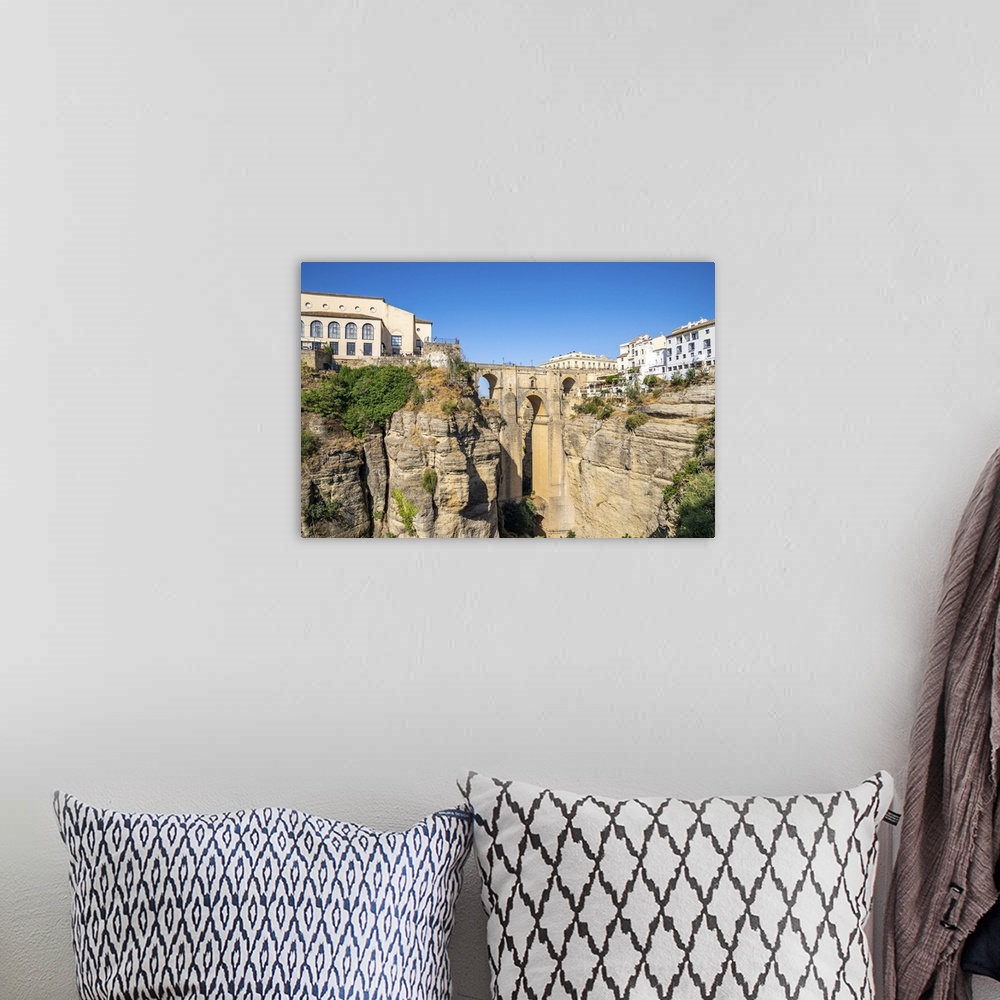 A bohemian room featuring Puente Nuevo (New Bridge), the tallest of the three bridges in Ronda crossing the Guadalevin Rive...