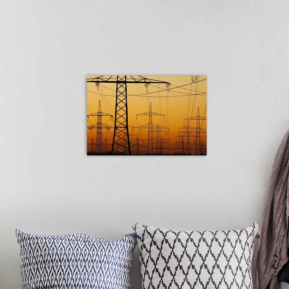 A bohemian room featuring Pylons and power lines in morning light, Germany