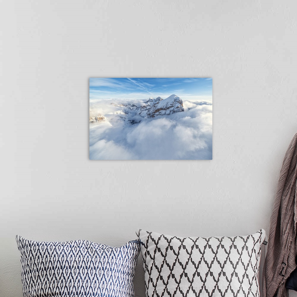 A bohemian room featuring Aerial view of the snow capped Tofane group in a sea of clouds, Dolomites, Belluno province, Vene...
