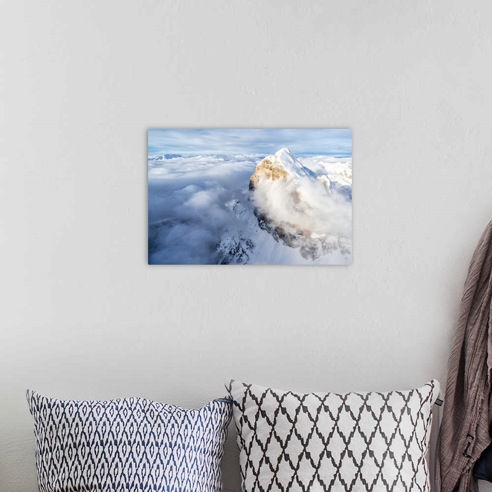A bohemian room featuring Snow covered Tofana di Rozes above the clouds, aerial view, Dolomites, Belluno province, Veneto, ...
