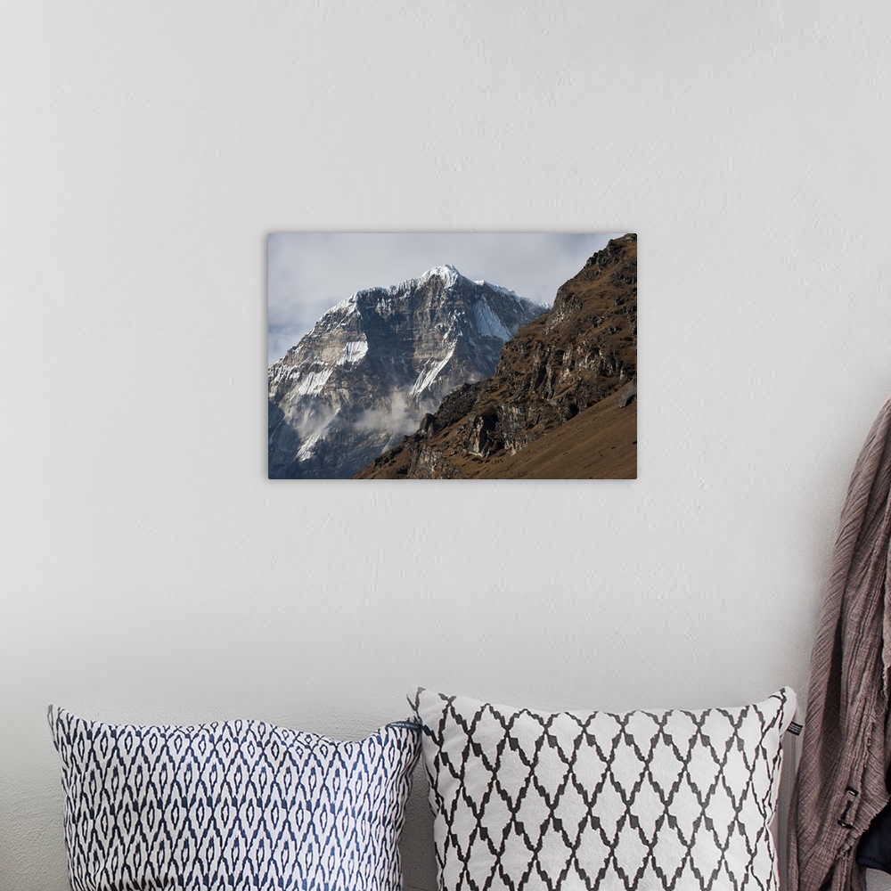 A bohemian room featuring The looming face of Jomolhari, the third highest mountain in Bhutan at 7326m, seen from Jangothan...