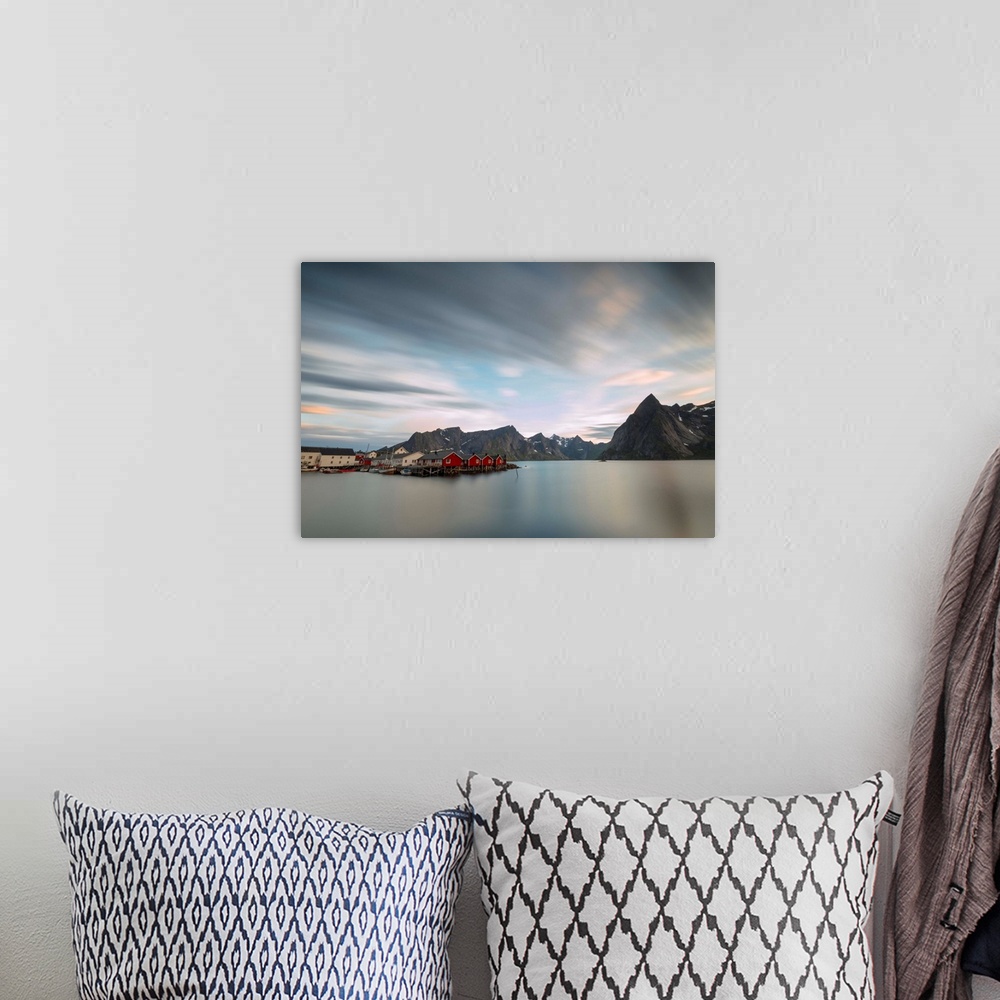 A bohemian room featuring The summer sunset at night on fishing village and cold sea, Hamnoy, Moskenesoya, Nordland county,...