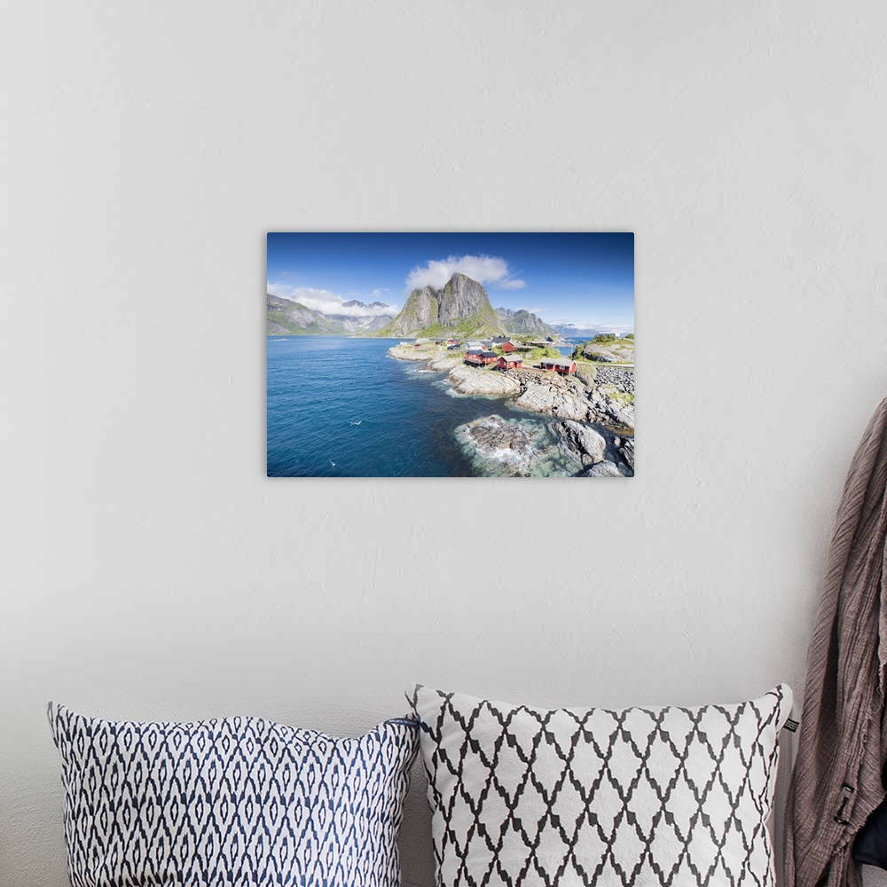 A bohemian room featuring Top view of the fishing village framed by blue sea and high peaks Hamnoy, Moskenesoya, Nordland c...