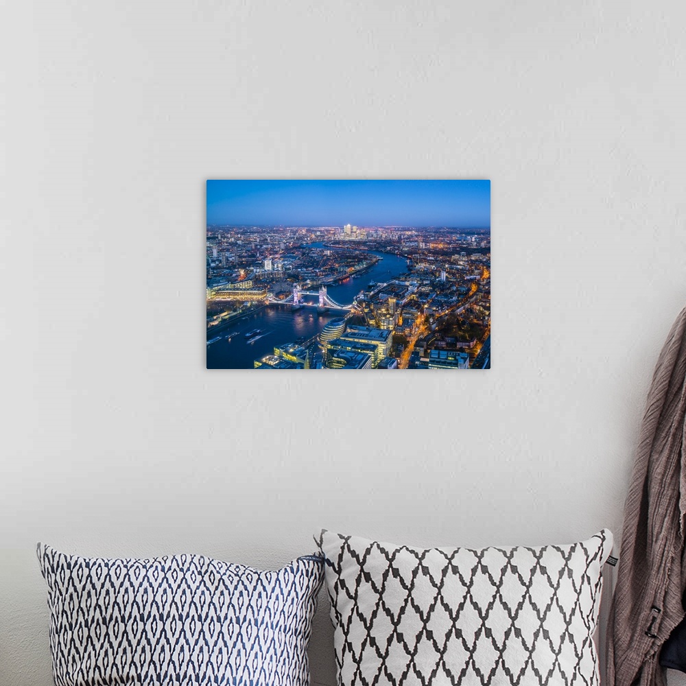 A bohemian room featuring High view of London skyline at dusk along the River Thames from Tower Bridge to Canary Wharf, Lon...