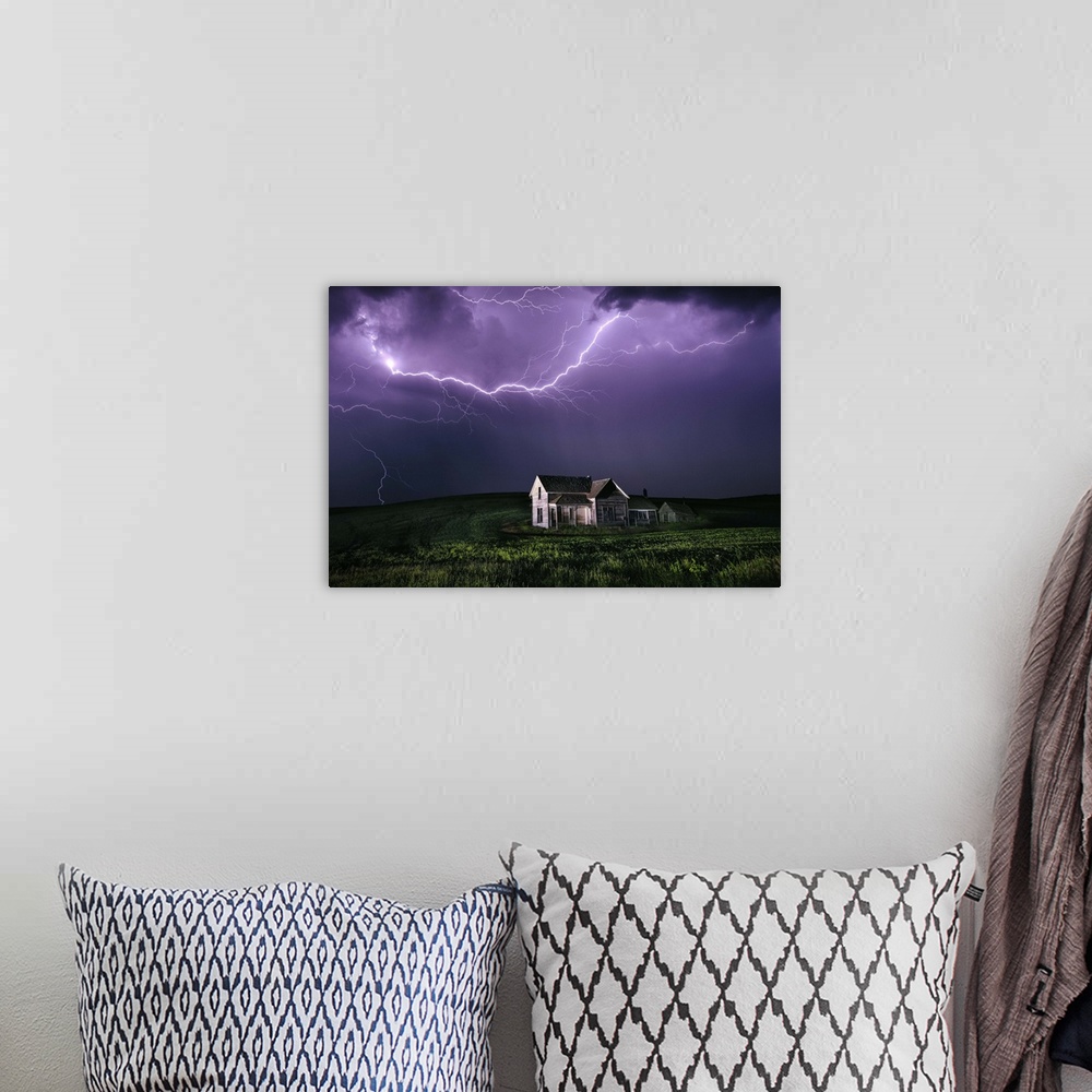 A bohemian room featuring Lighting storm over abandoned home