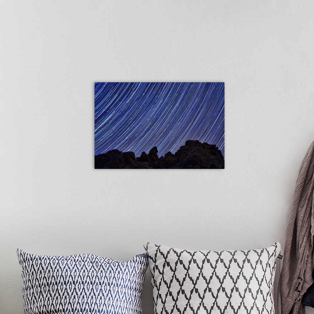 A bohemian room featuring Star trails in the sky over Death Valley, California.