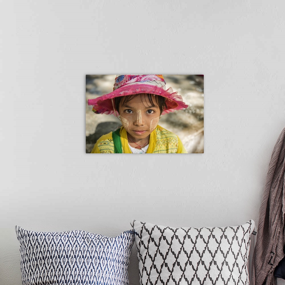 A bohemian room featuring Young Burmese girl with Tanaka face paint