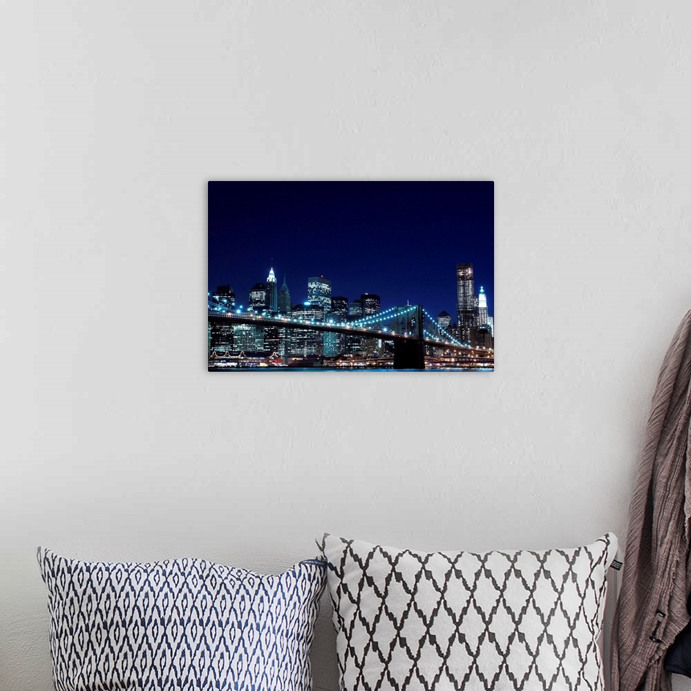 A bohemian room featuring Brooklyn Bridge and Manhattan Skyline At Night, New York City.