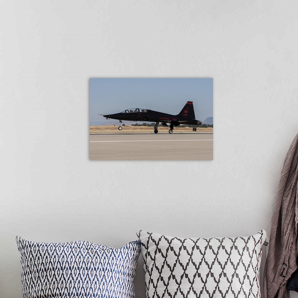 A bohemian room featuring A U.S. Air Force T-38A taking off from Beale Air Force Base, California.