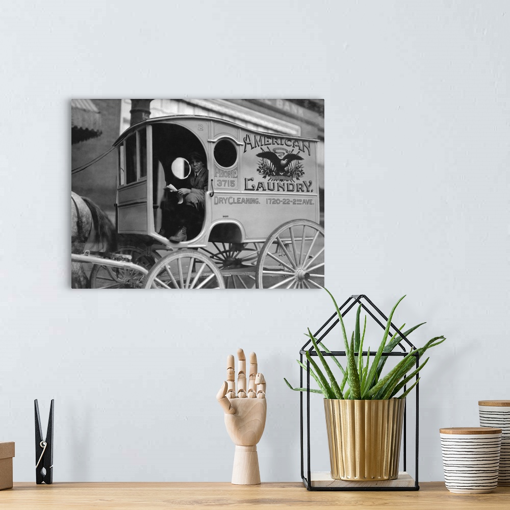 A bohemian room featuring American history photograph of a young wagon delivery boy, Birmingham, Alabama, 1914.