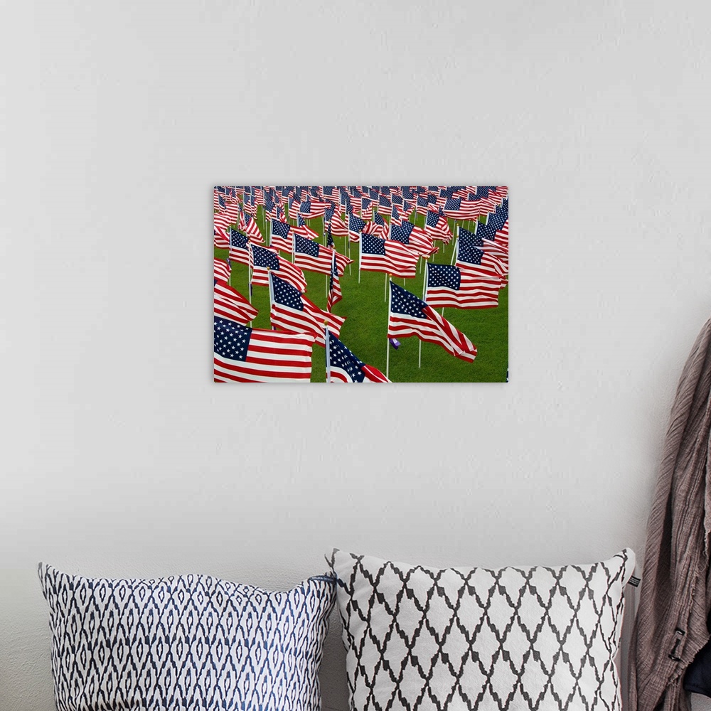 A bohemian room featuring An abundance of American Flags.