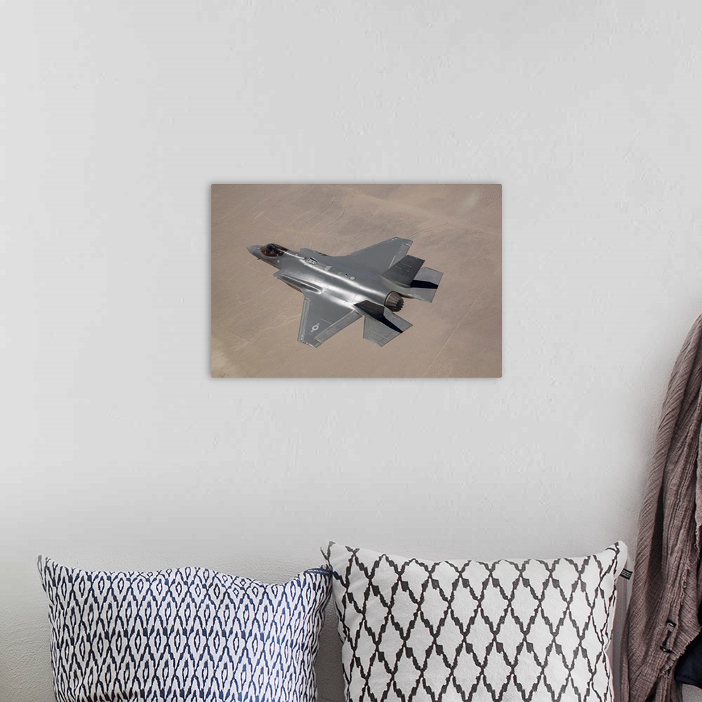 A bohemian room featuring June 11, 2014 - An AF-2, the second production F-35 Lightning II of the U.S. Air Force, flies ove...