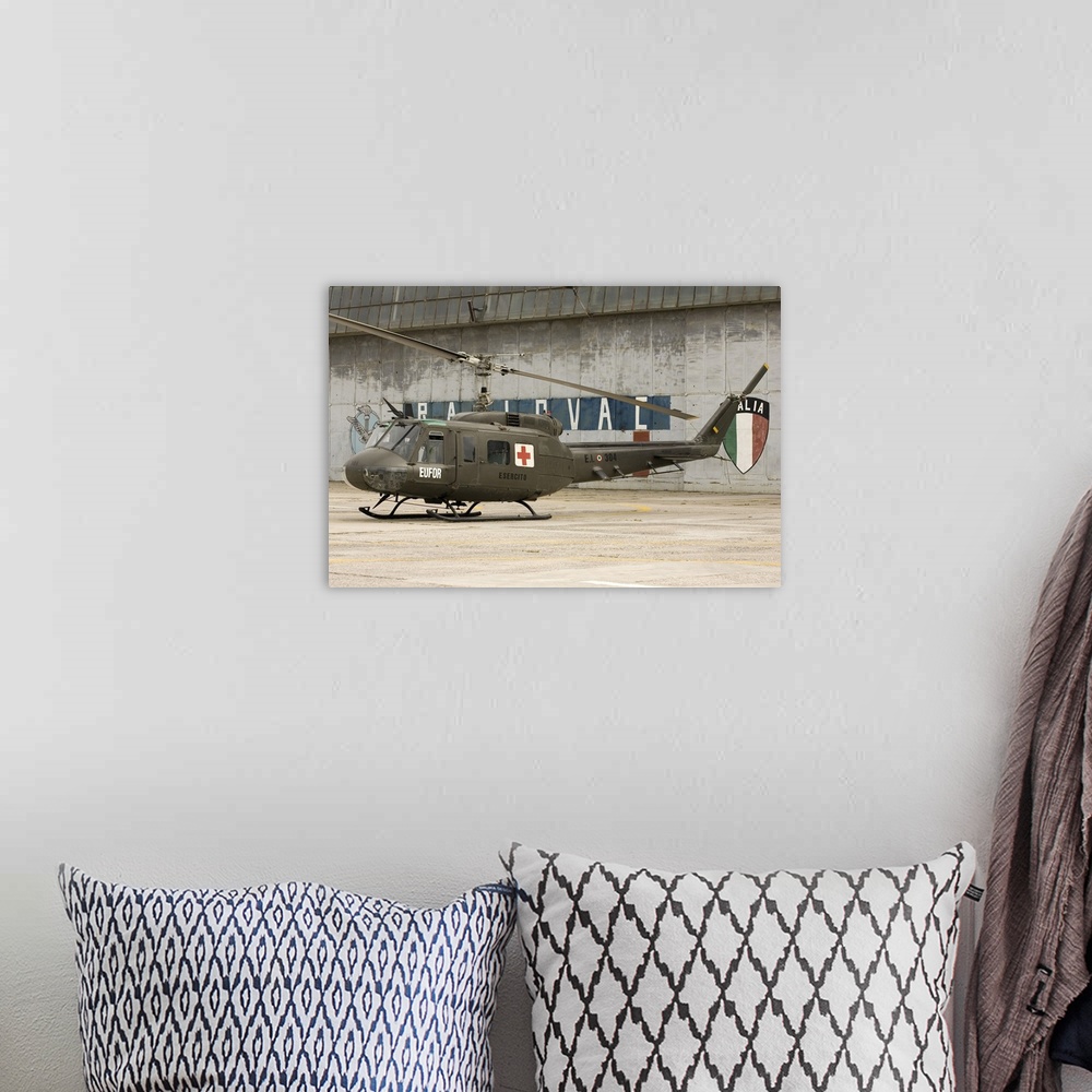 A bohemian room featuring An Italian Army AB205A-1 helicopter at Camp Rajlovac in Bosnia-Herzegovina.