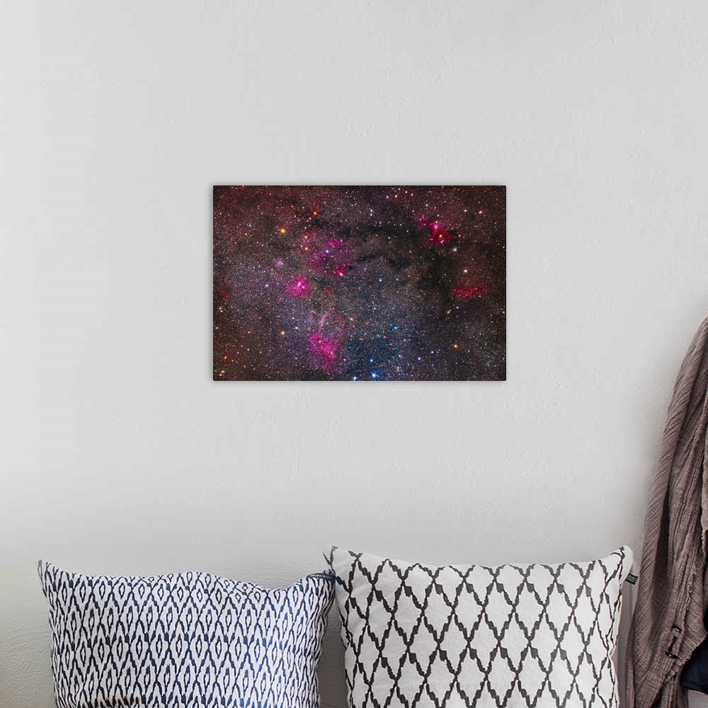 A bohemian room featuring A collection of bright star clusters and colorful nebulae on the border of Cassiopeia and Cepheus...
