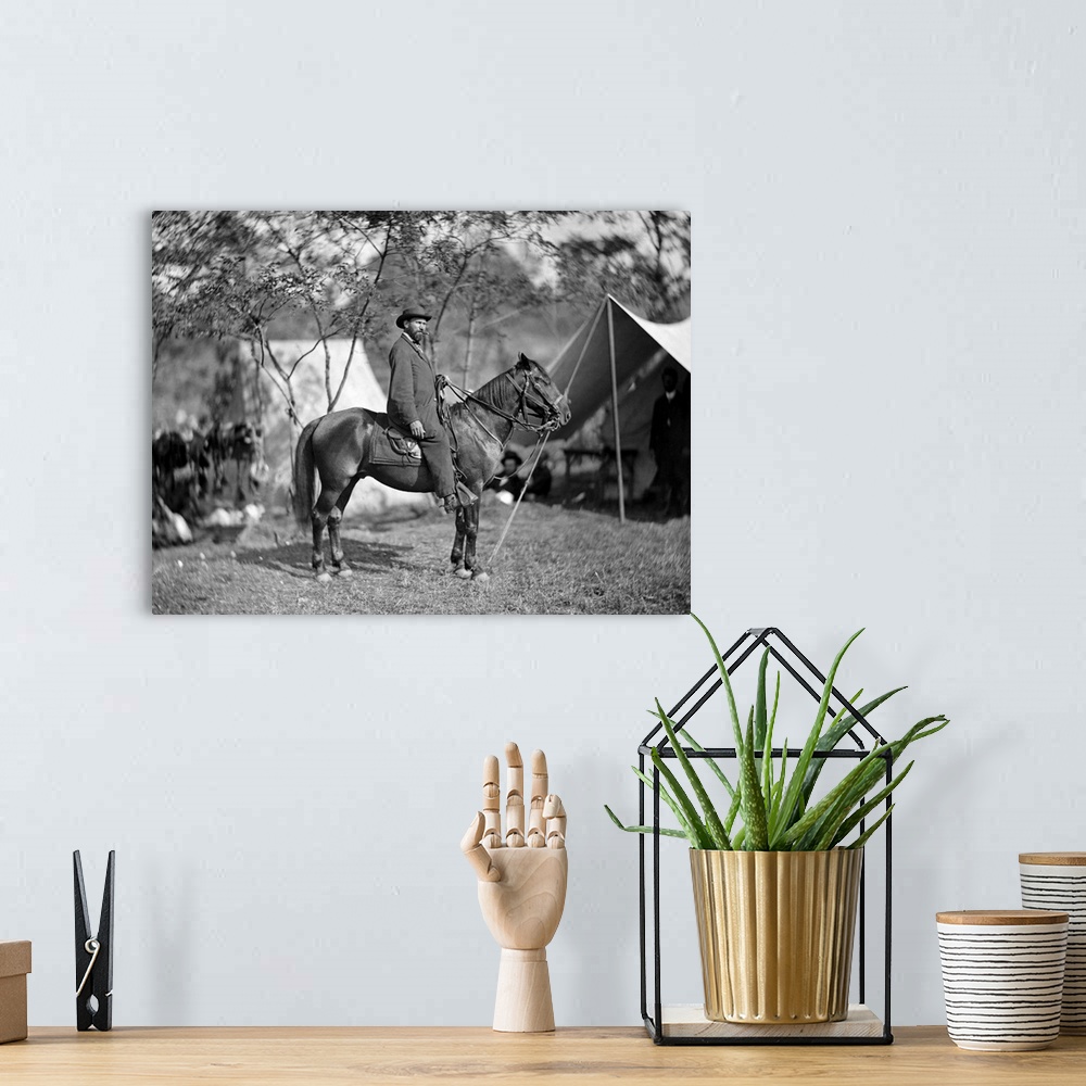 A bohemian room featuring Civil War photo of Allan Pinkerton seated on a horse during teh Battle of Antietam.