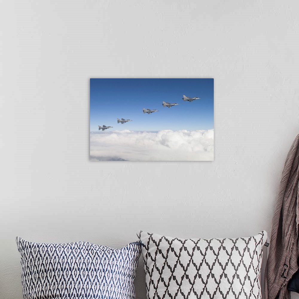 A bohemian room featuring Five F-16Cs of the U.S. Air Force 310th Fighter Squadron fly in formation.
