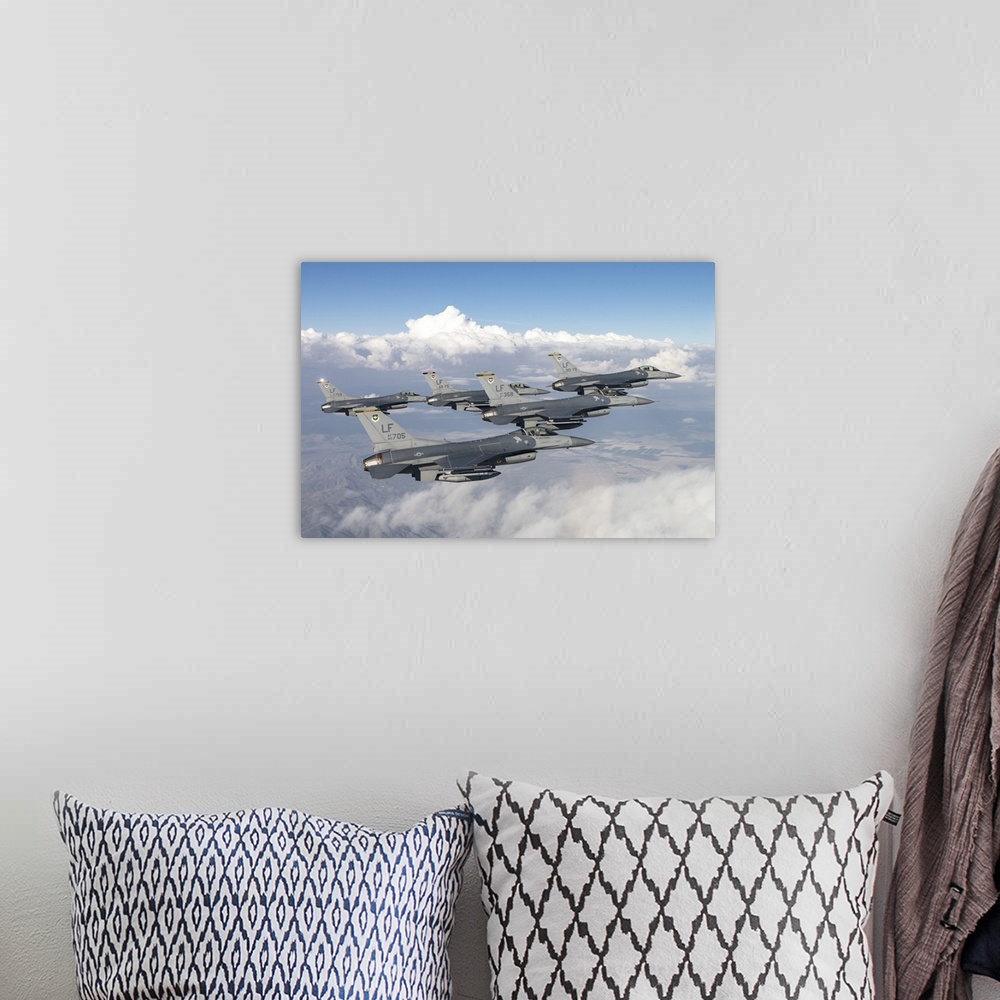 A bohemian room featuring Five F-16Cs of the U.S. Air Force 310th Fighter Squadron fly in formation.