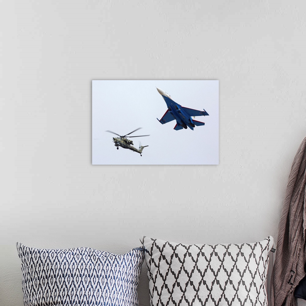 A bohemian room featuring Formation flight of a Russian Su-27 and a Mil Mi-28N helicopter.
