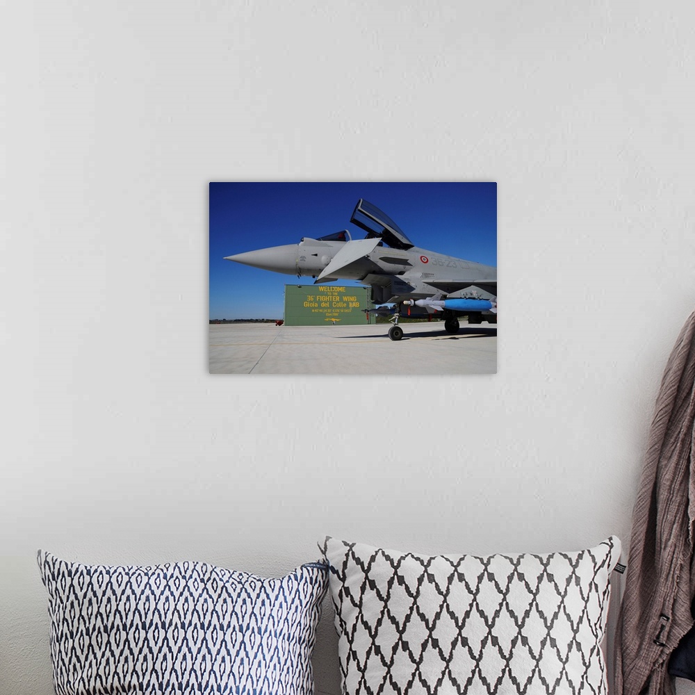 A bohemian room featuring Italian Air Force Eurofighter F-2000 armed with bombs.
