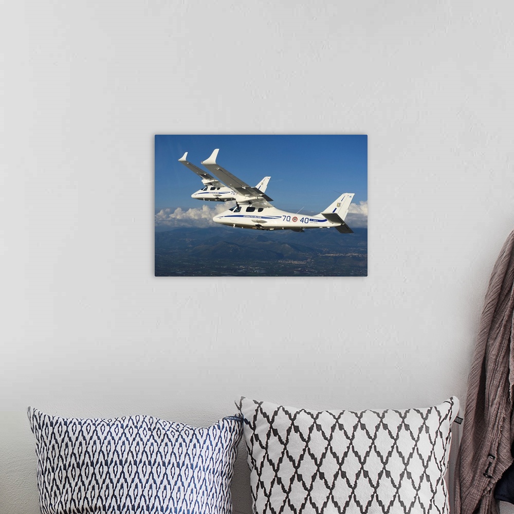 A bohemian room featuring Italian Air Force Tecnam T-2006 trainers from 70th Stormo in-flight.